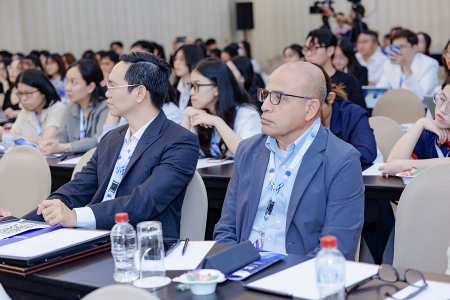 Participants listening to a research presentation at MBIC 2026